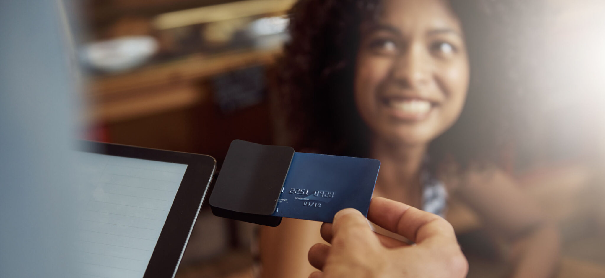 Woman paying with a credit card