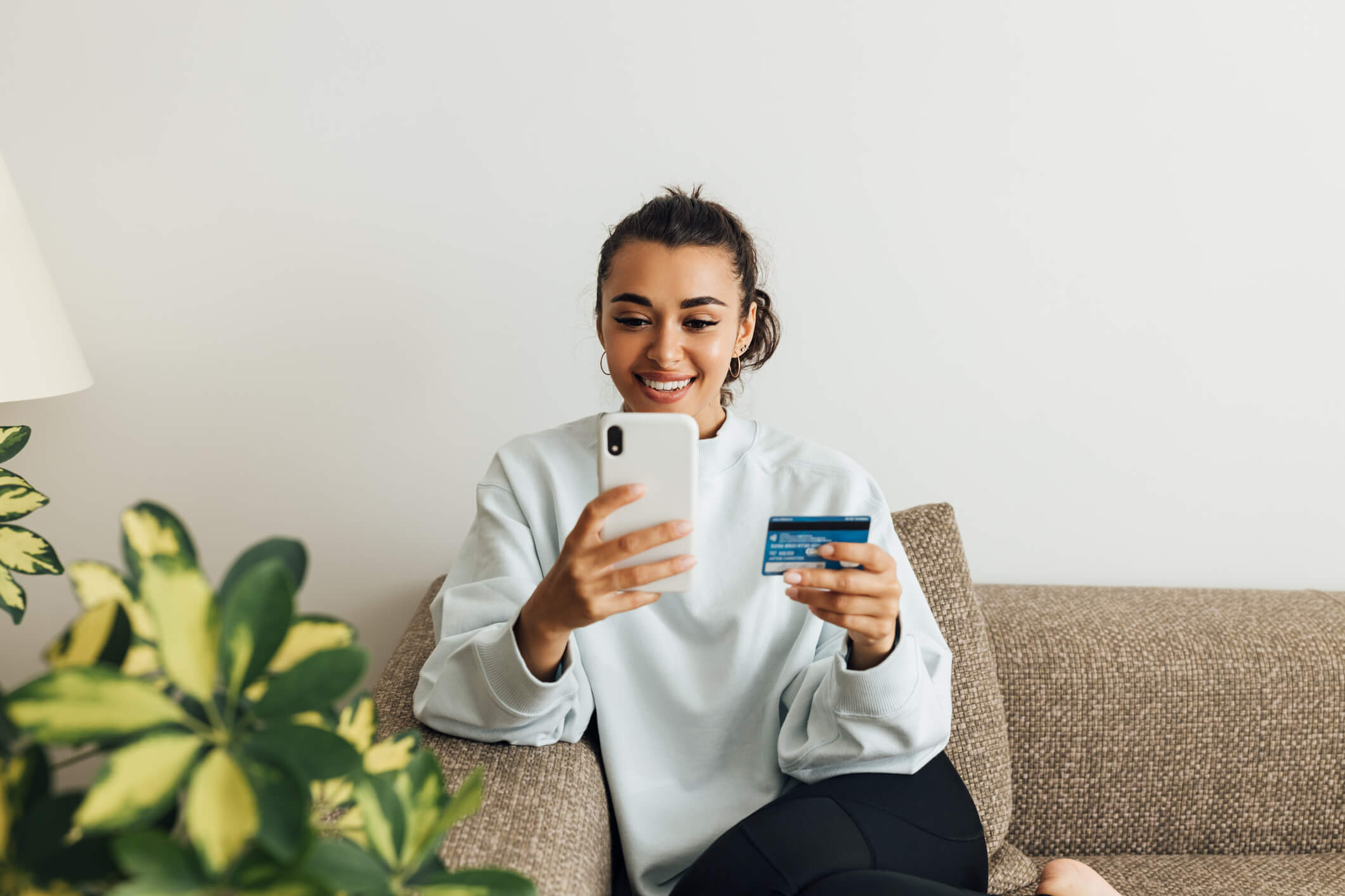 woman learning about isv integrated payments on her phone