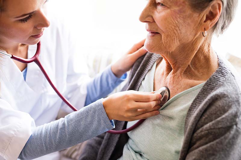 doctor checking patient